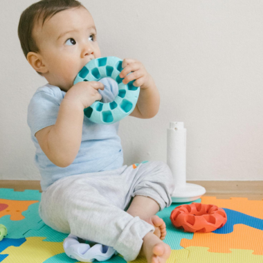 charming baby in dubai playing with toys.webp
