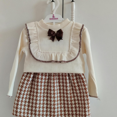 cute baby outfit featuring a white top.webp